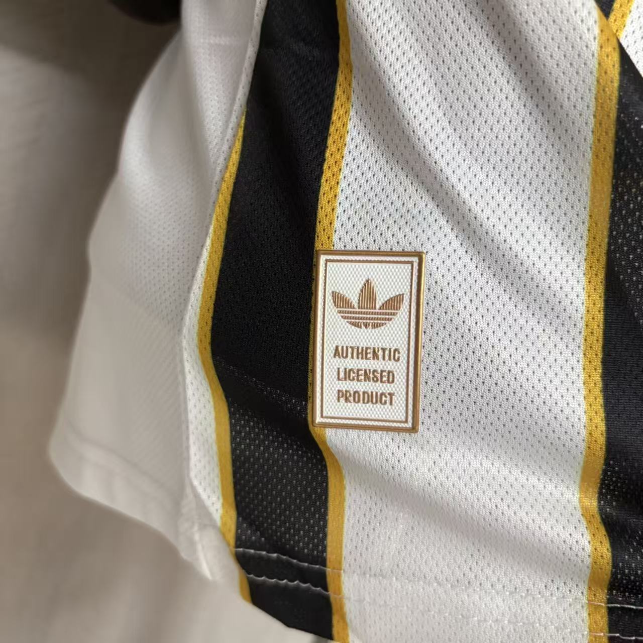 Boca Juniors player version soccer jersey 2026/27 in black and white stripes with gold trim - view 10