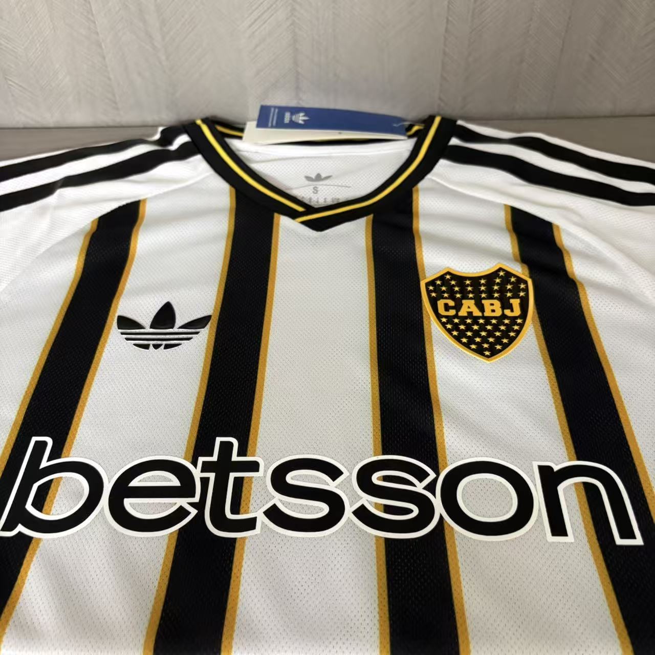 Boca Juniors player version soccer jersey 2026/27 in black and white stripes with gold trim - view 9